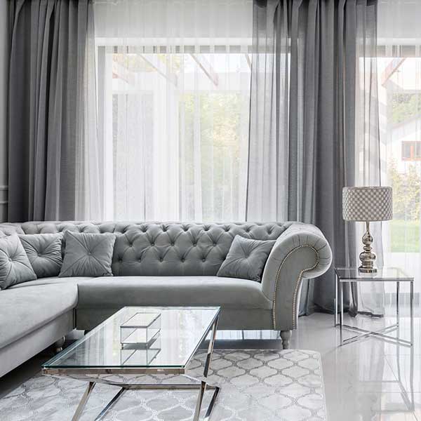 A living room with a sheer curtain done by The Great Curtain Company in Austin, TX